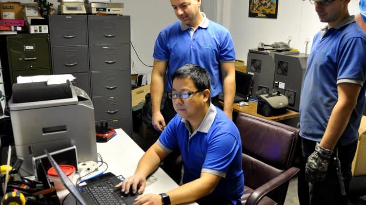 SunTech Recycle technicians performing secure data wiping and asset logging in-house